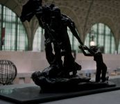 Statue of the angel of death carrying away a man